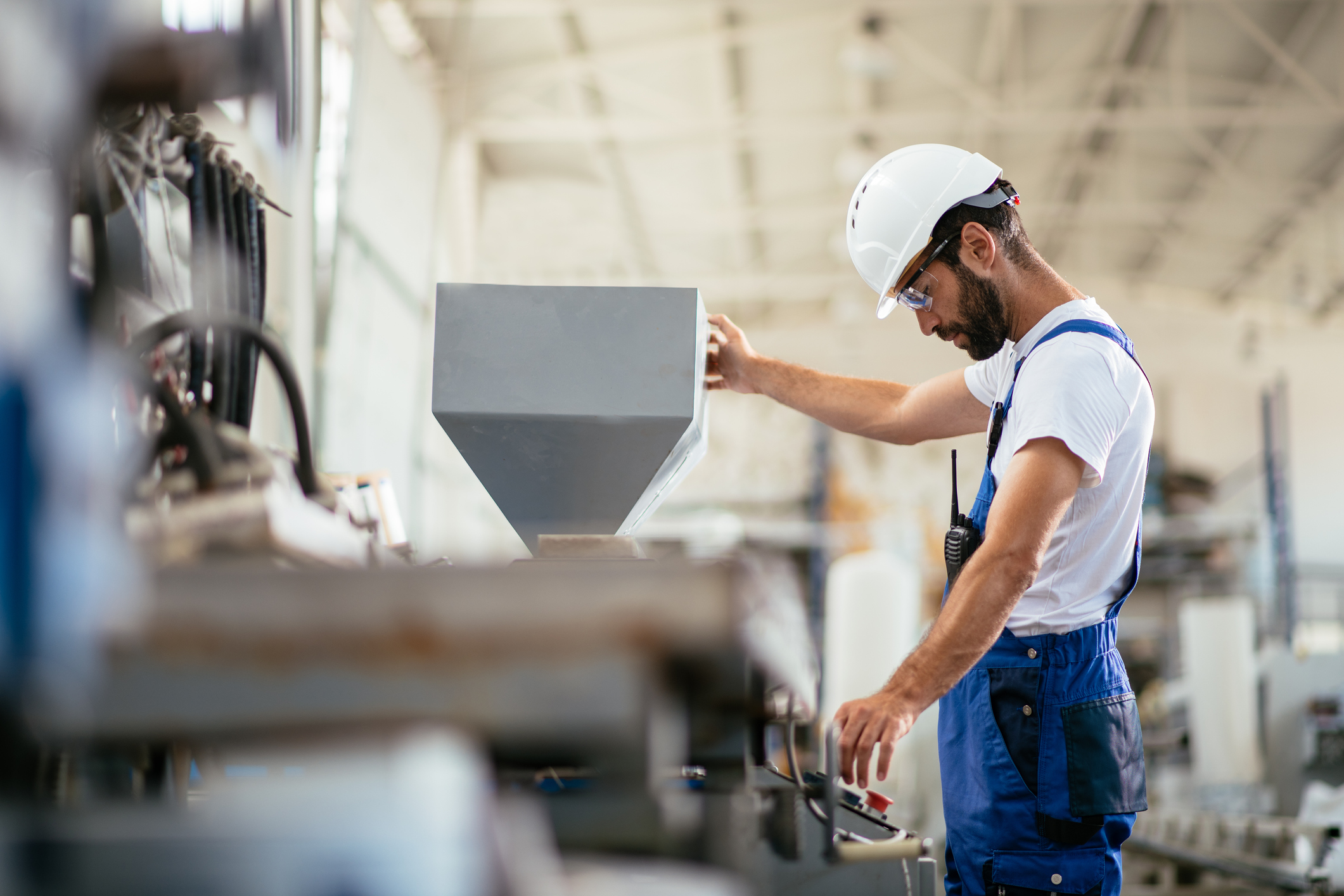 plastics engineers examining machine