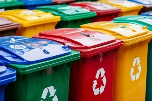 array of colorful recycling bins with labels for sorting different types of recyclable materials