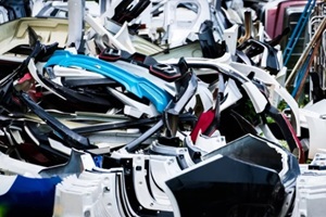 pile of used front bumper, rear bumper, and spoiler of car for recycle