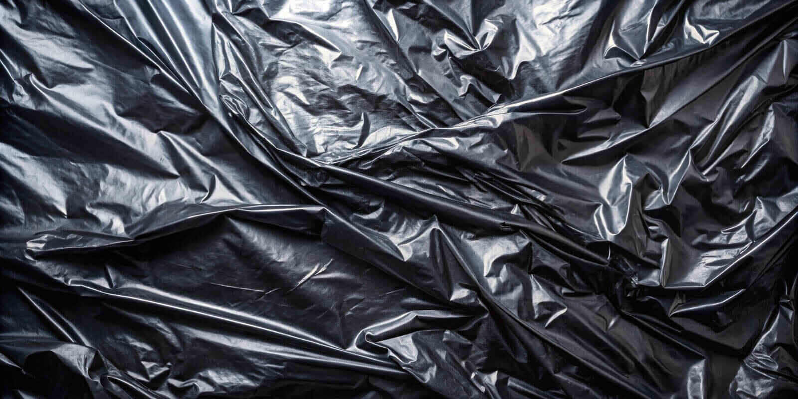 Black plastic film wrap texture background, plastic, film, wrap, texture, black,dark, glossy, sleek, shiny, flexible
