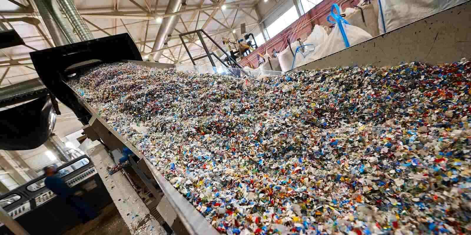 Chopped waste plastic transported by production line