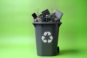 dark gray recycle bin full of old electronics