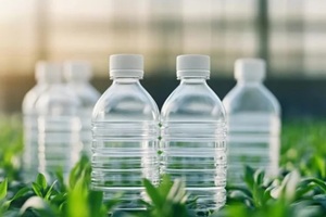 plastic bottles in green leaves