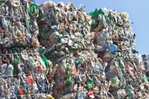 stack of plastic bottles for recycling against blue sky