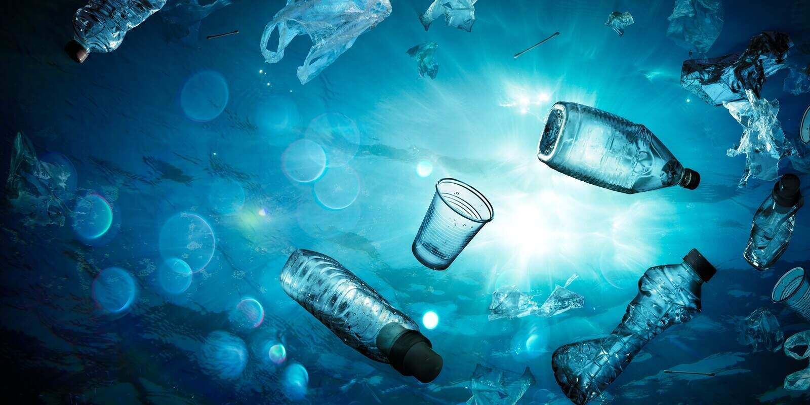 underwater shine with garbage floating on sea