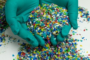 hands holding recycled plastic