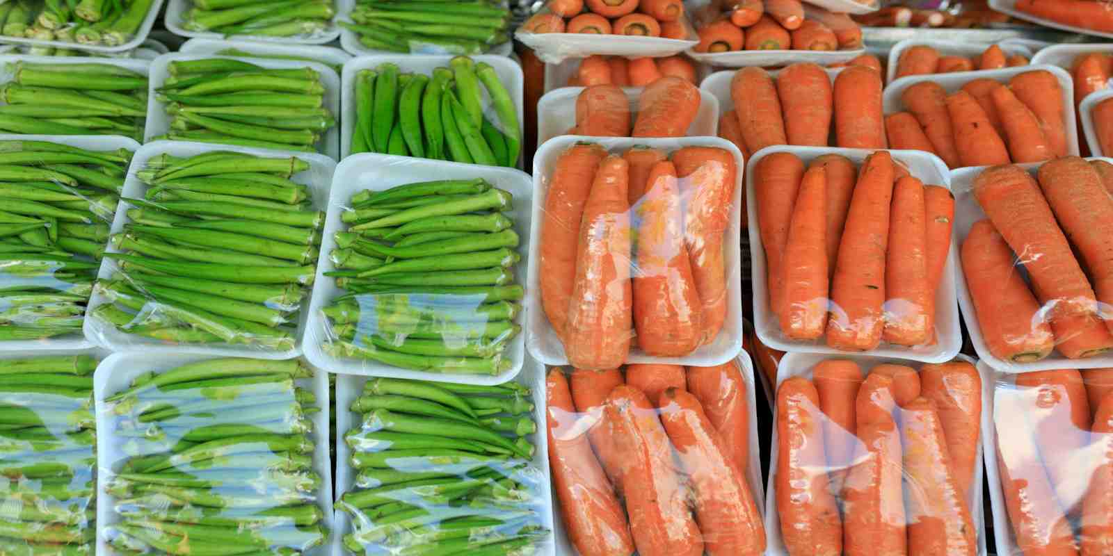 Okra and Carrots in Plastic Packaging