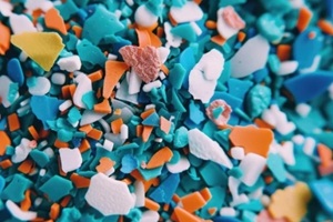 colorful spread of microplastics and plastic waste fragments