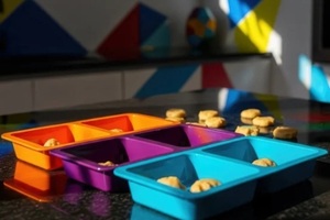 multi color plastic trays with cookies