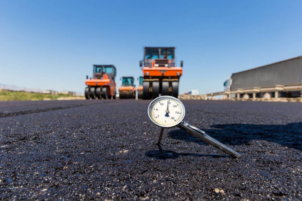 Asphalt concrete, Thermometer in hot aspahlt on road roller background