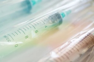 heap of medical pills in white, blue and other colors