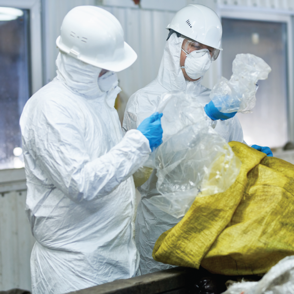 2 white people in checking the waste