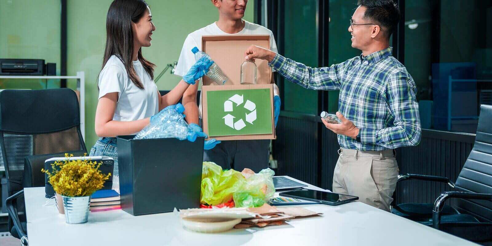 team discusses waste management strategies at a desk, separating plastic waste